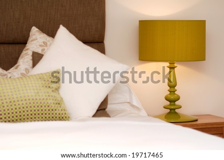 Lamp in brown-green designed bedroom