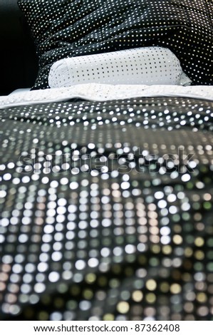 Detail of the dotted white pillow with dotted black duvet