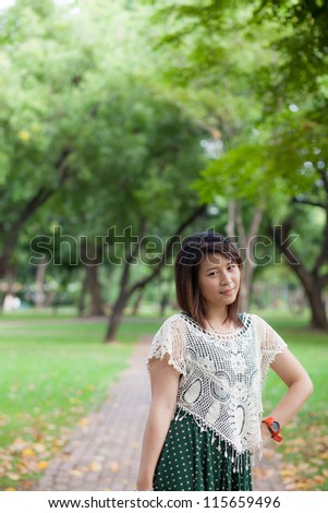 woman asian portrait in park.cute woman asian post portrait in park.