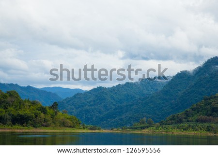 Sky, mountains and rivers. Natural scenery in the morning. Fog covered mountains.