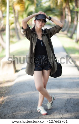 portrait cute thailand woman.active in the park.