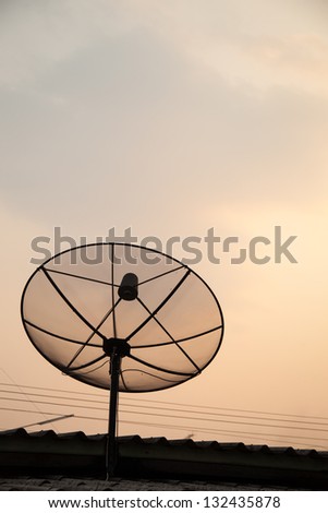 Satellite TV receiver. Mounted on the roof. In the evening.