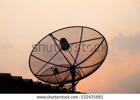 Satellite TV receiver. Mounted on the roof. In the evening.