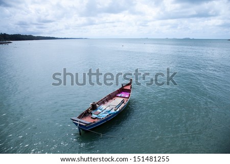 Fishing boats moored at sea. Behind a calm sea.