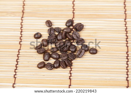 Pile coffee beans on top table wooden.black beans coffee.