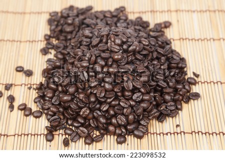 Pile coffee beans on top table wooden.black beans coffee.