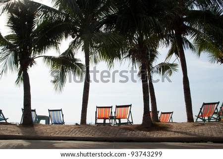 Holiday by the sea. Sit on benches along the beach under the coconut trees.