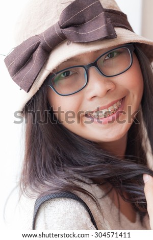 clouse up face asia woman.joy and smile woman wear hat and eyeglasses.