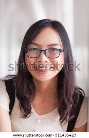 joy and smile asia woman.portrait asia woman smile and relax long black hair.wear eyeglasses.