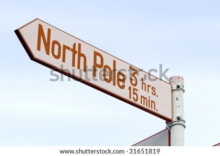 Road sign to the North Pole! Red and white sign on metal pole