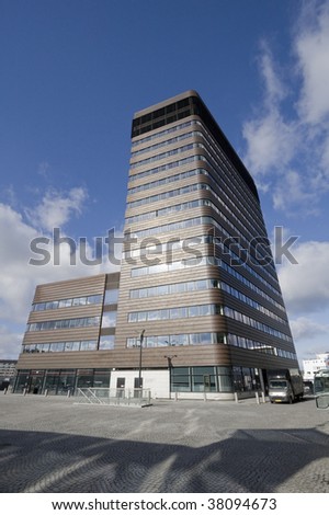 A moderns office building in Copenhagen, Denmark. It\'s facade is made of cobber.