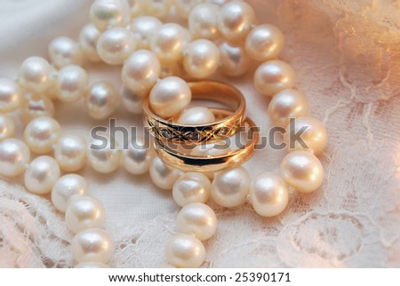 stock photo Wedding rings and a pearl necklace