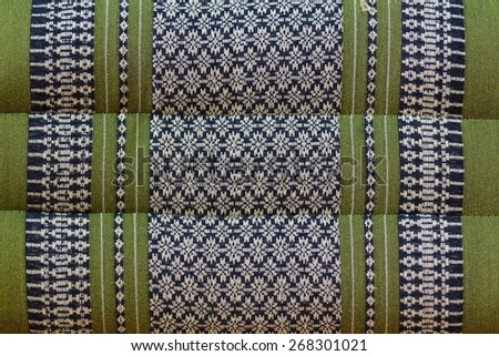 Close up of thai style scatter cushion texture cover