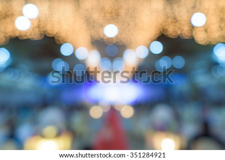 Beautiful blur wedding party under purple lights, bokeh background