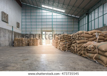 Hemp sacks containing rice in warehouse