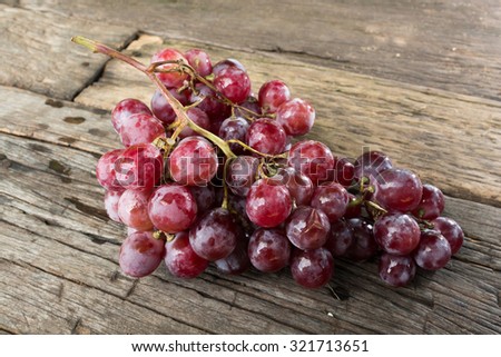 still life of fresh organic grapes on wooden