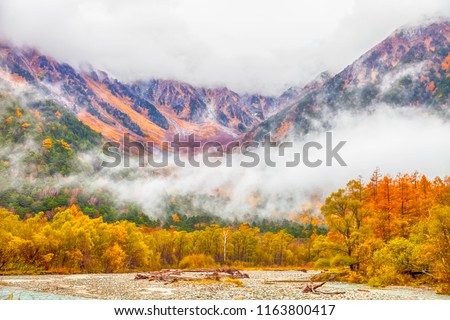 Kamikochi National Park in the Northern Japan Alps of Nagano Prefecture, Japan. Beautiful mountain in autumn leaf with river.