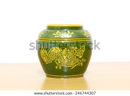 Earthenware water jar dragon design on white background.