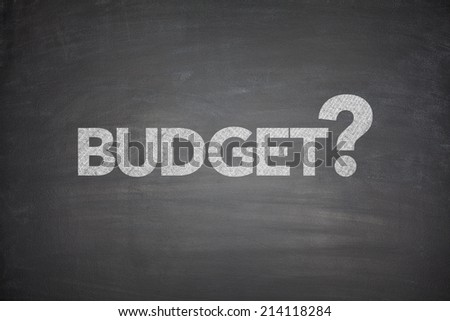Budget with question mark on black Blackboard