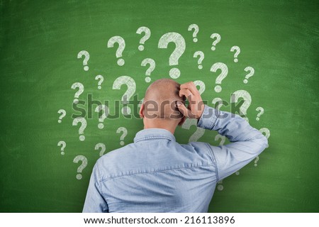 Question Mark on black Blackboard with businessman