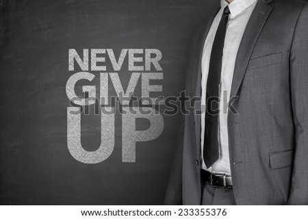 Never give up on blackboard with businessman