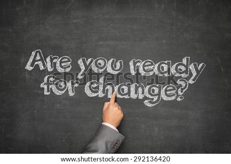 Are you ready for change concept on black blackboard with businessman hand