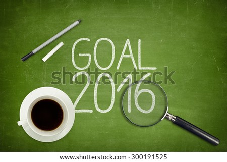 Goal 2016 concept on green blackboard with empty paper sheet and coffee cup