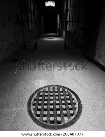 manhole cover in a dark hallway