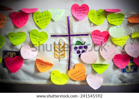 AMAZING GRACE LUTHERAN CHURCH, HONG KONG - DEC 28. Christian wrote the wishes for the year of 2015 on the altar surrounding the cross at Amazing Grace Lutheran Church, Hong Kong at Dec 28, 2014..