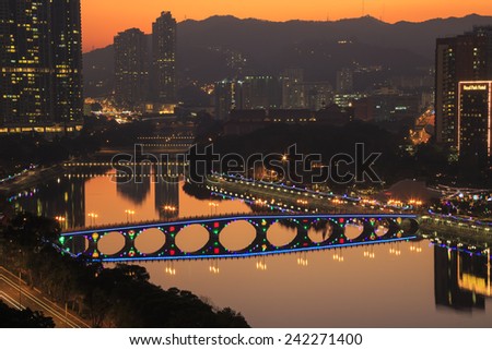 SHING MUN RIVER, HONG KONG - DEC 31: Sunset view of Shing Mun River with Christmas decoration at Shatin, Hong Kong on Dec 31, 2015. The river is famous for riverside walkers and cyclists.