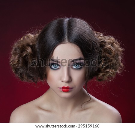 Girl with interesting hair style and doll lips