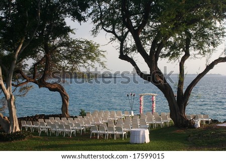Chairs and arch set up for oceanfront wedding, Hapuna Beach, Hawaii.