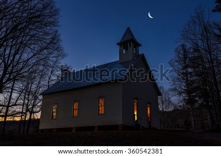 Twilight with crescent moon over primitive church in the Great Smoky Mountains National Park