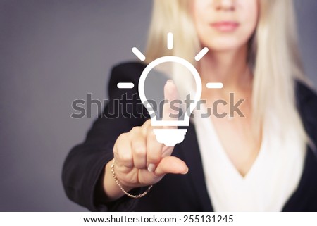 Businesswoman touch button idea bulb icon