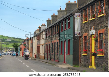 DINGLE TOWN, KERRY, IRELAND - JUNE 4, 2012: Colorful old buildings in the street of Dingle, which is a town in County Kerry, Ireland. The only town on the Dingle Peninsula.