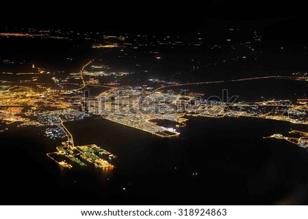views of Doha city from an airplane window at night