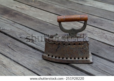 antique iron, Old iron, Old coal iron on the old wooden floor.