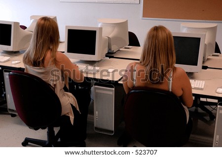 Two Students Working In The Computer Lab