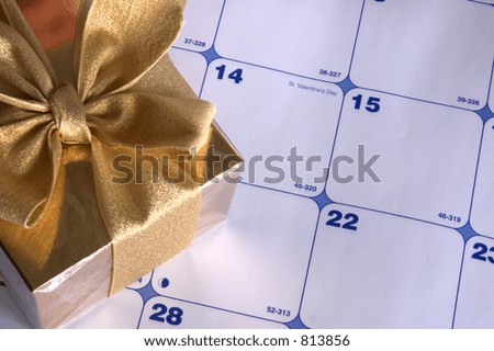 Desktop Calendar At Valentine's Day, With A Gift Box Of Chocolates