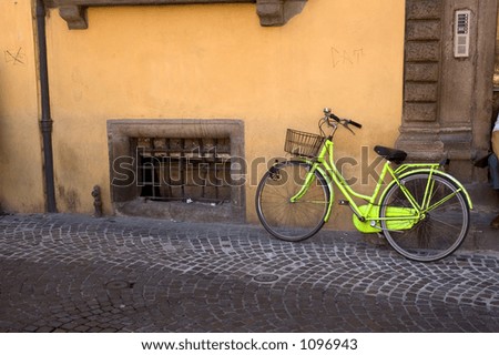 Old Yellow Bicycle Parked On An Italian Street