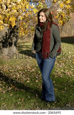Young Woman Enjoying A Sunny Autumn Day