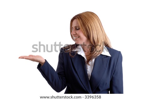 Beautiful Blonde Young Businesswoman Holding Her Hand Out For Your Project to Balance On It, Isolated Over White