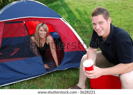 Man And Woman Couple Camping In A Tent In The Countryside