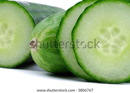 Sliced And Whole English Cucumber, Isolated Over White