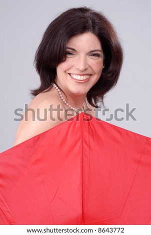 Pretty Brunette Woman Hiding Behind A Red Umbrella