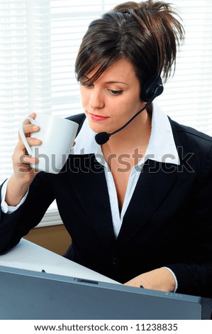 Businesswoman Customer Service Agent Wearing A Telephone Headset