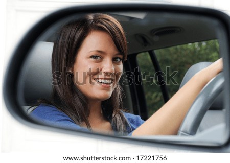 Woman Driver Framed By Her Driving Mirror