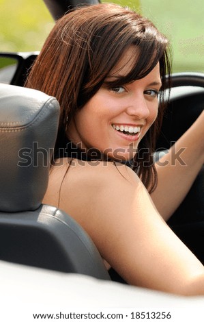 Beautiful Brunette Young Woman Sat In A Convertible Sports Car