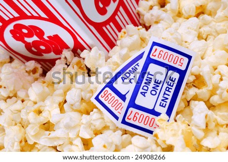 Overflowing Box Of Movie Popcorn With Two Cinema Tickets