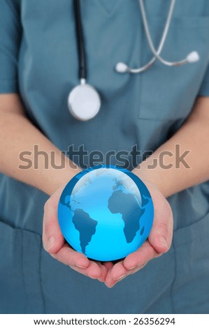 Female Doctor Holding A World Globe In Her Hands, Concept Of World Health
